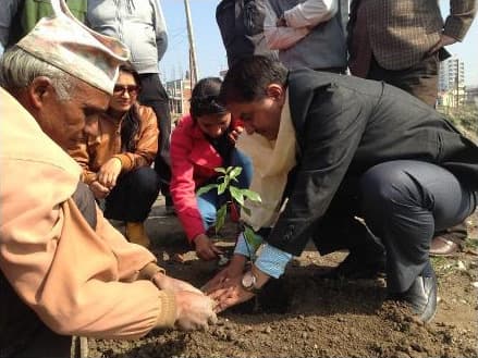 Mr. Ramu Subedi, Team Leader of MSFP, planting a tree at the Smriti Brichhya site at Manohara